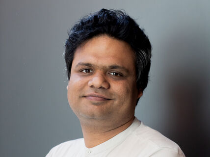 Portrait photograph of a man (Vikas Garg) in a white t-shirt