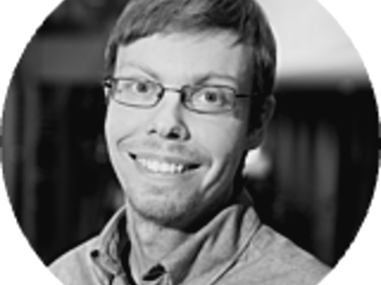 Portrait of a smiling man with glasses.