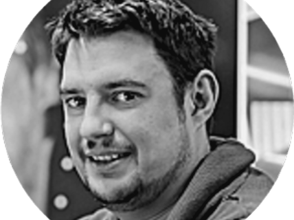 Portrait of a smiling dark-haired man.