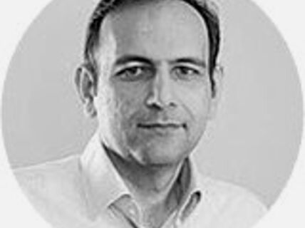 Portrait of a dark-haired man.