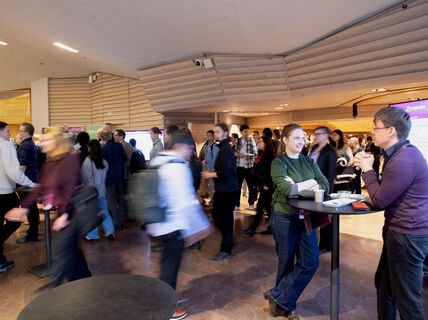 People walking and mingling at a conference