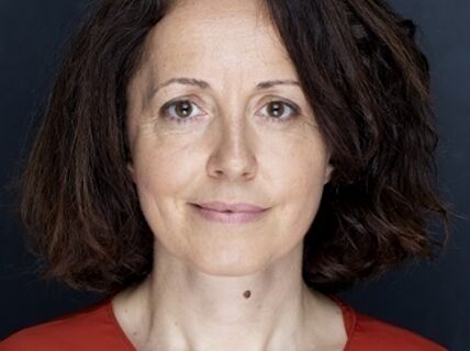 Photo of woman in red shirt