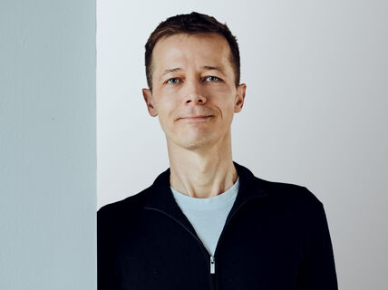 Portrait photo of person wearing dark shirt