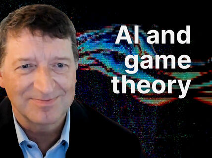 Smiling man in suit before glitchy blue and red digital backdrop, text reads “AI and game theory”.