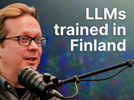 Man with glasses speaking into studio mic, text reads “LLMs trained in Finland” on colourful blurred background