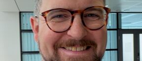 Smiling man wearing glasses
